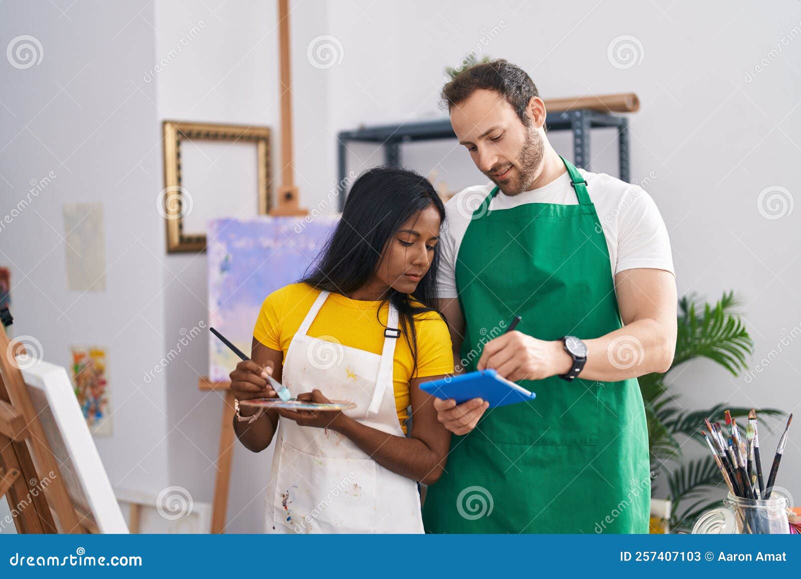 Man and Woman Artists Using Touchpad Drawing at Art Studio Stock Image