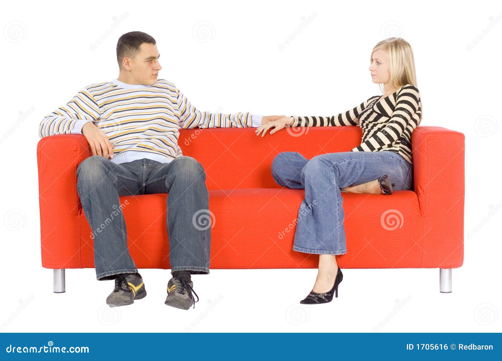 Man and Woman on Couch with Serious Expressions Stock Photo Image of