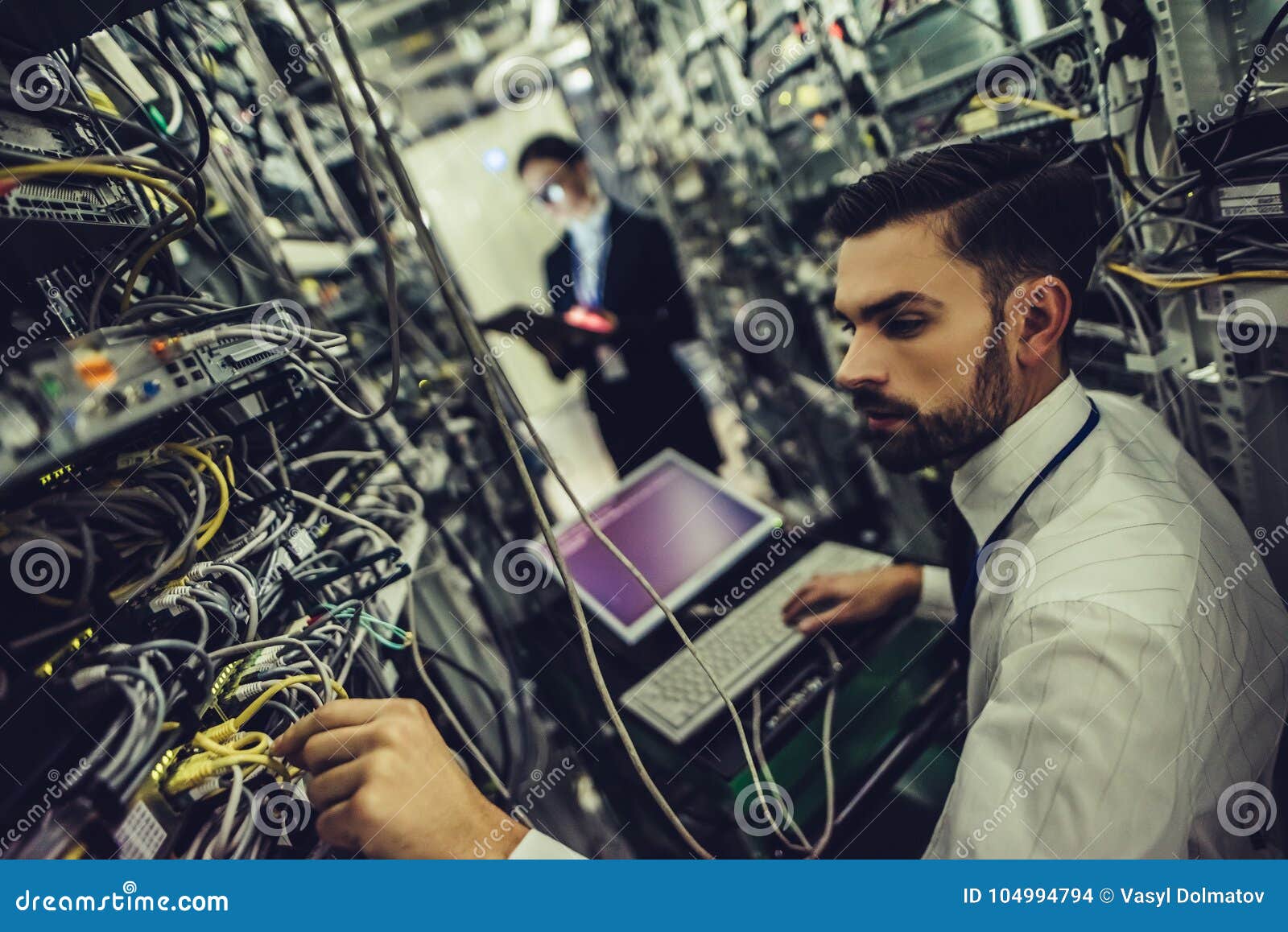 man and woman in data centre