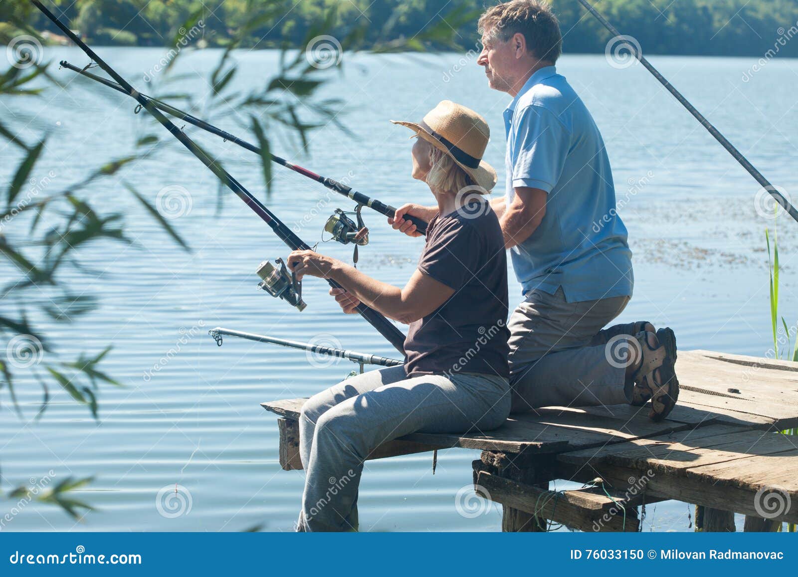 Man and Woman with Fishing Rods Stock Photo - Image of vacation, pontoon:  76033150