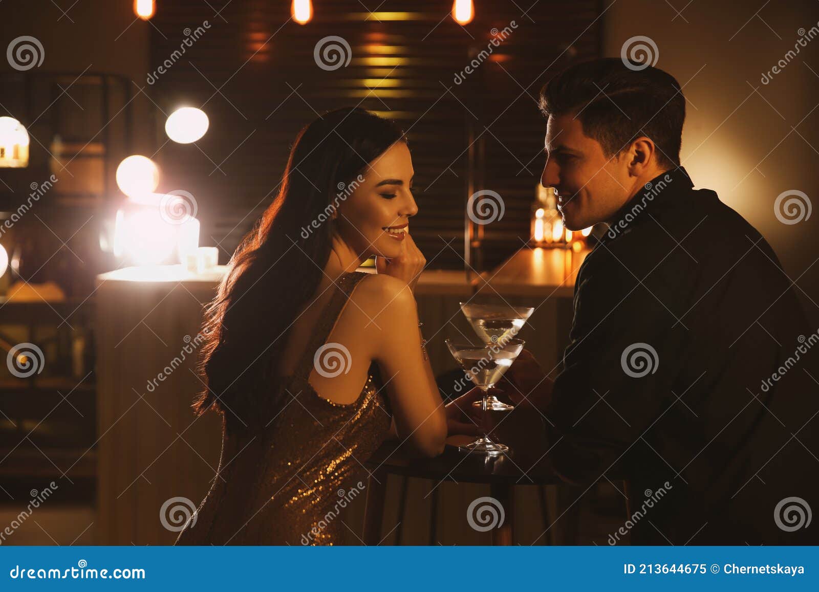 man and woman flirting with each other in bar