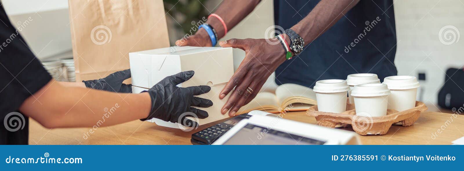 man and woman holding for white box