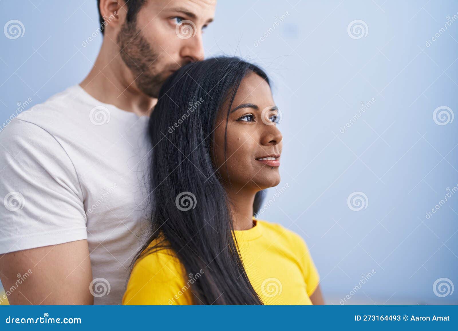 Man And Woman Interracial Couple Hugging Each Other And Kissing At Home