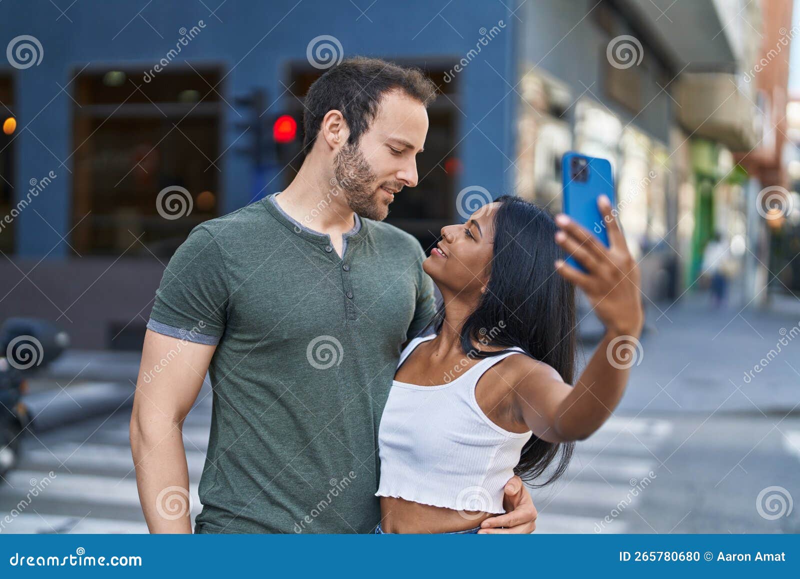 Man And Woman Interracial Couple Making Selfie By Smartphone At Street