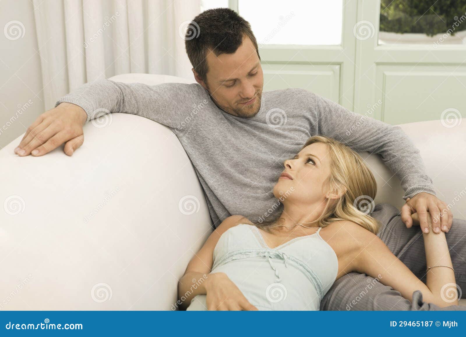 Man and Woman Lounging on Sofa Stock Image Image of boyfriend