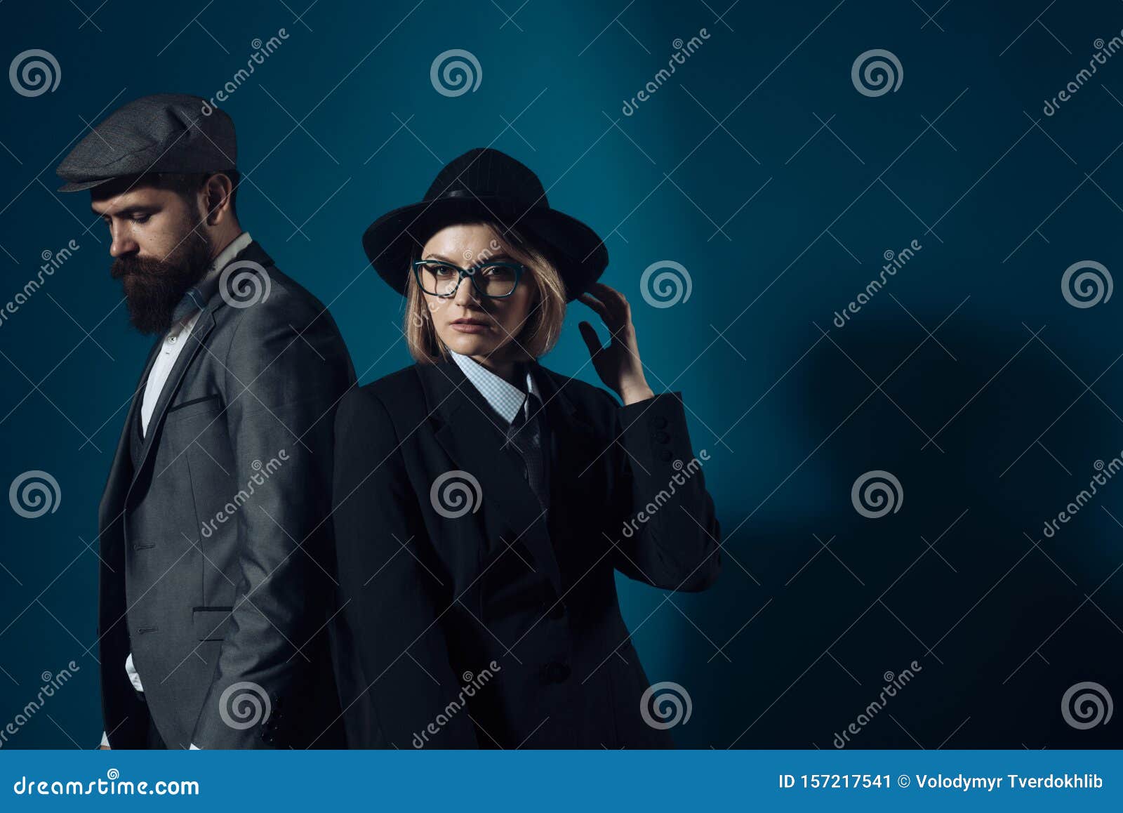 man and woman in oldfashioned suit and hat
