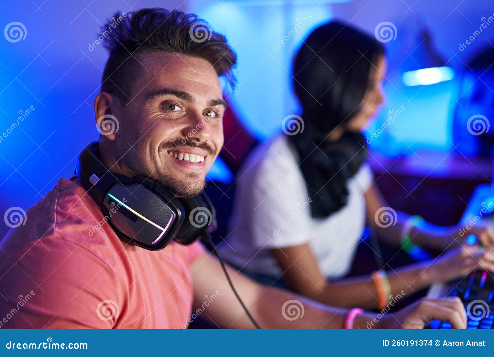 Man and Woman Streamers Playing Video Game Using Computer at Gaming