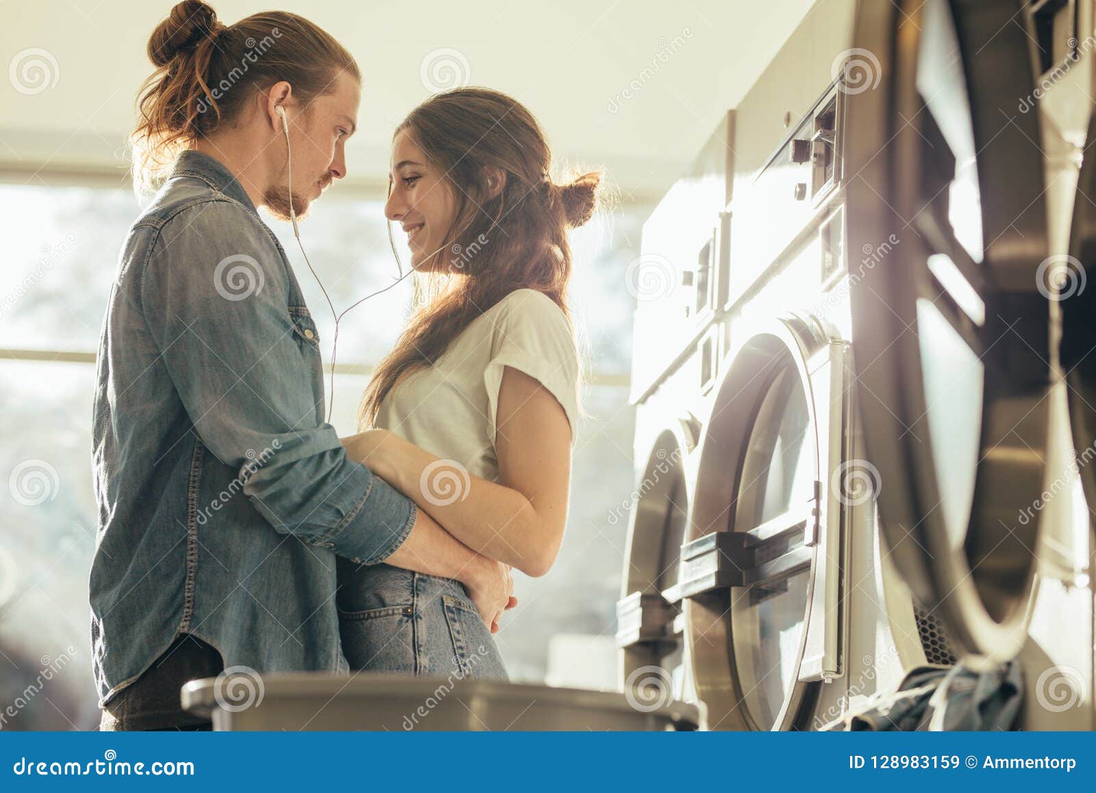 Couple In Love Standing Together Listening To Music In Laundry R Stock Image Image Of Holding