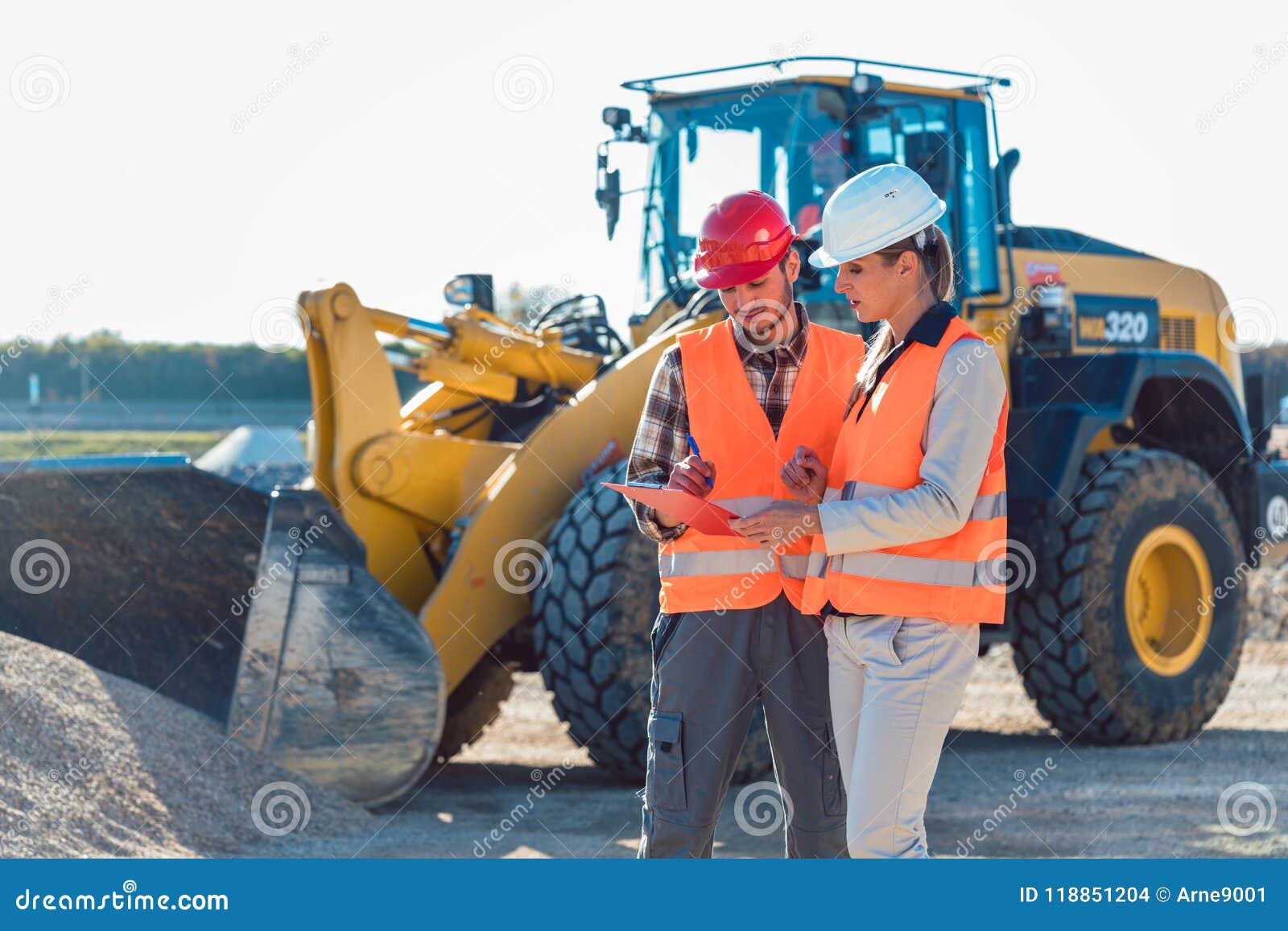man and woman worker on construction site