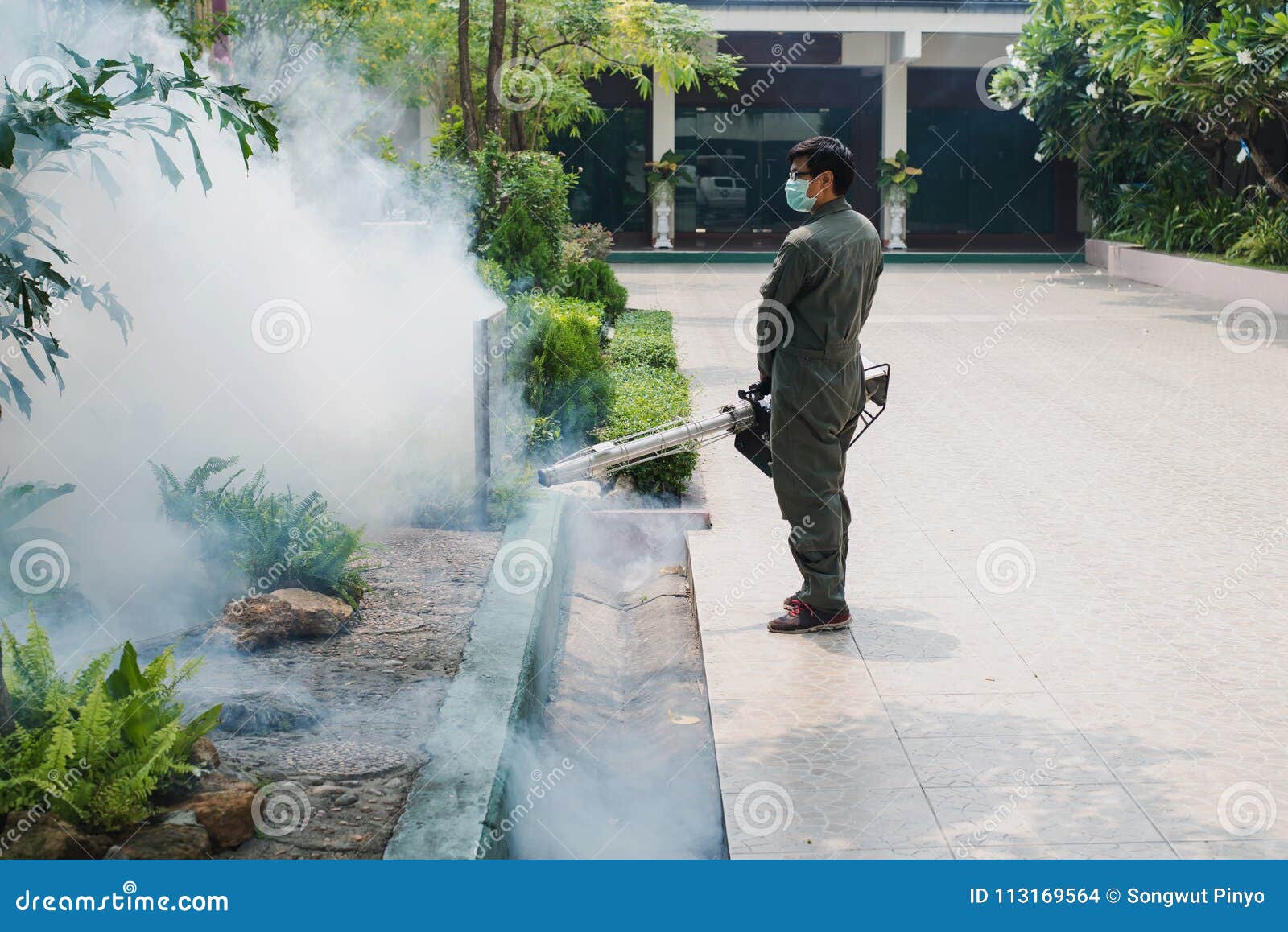 man work fogging to eliminate mosquito for preventing spread dengue fever and zika virus