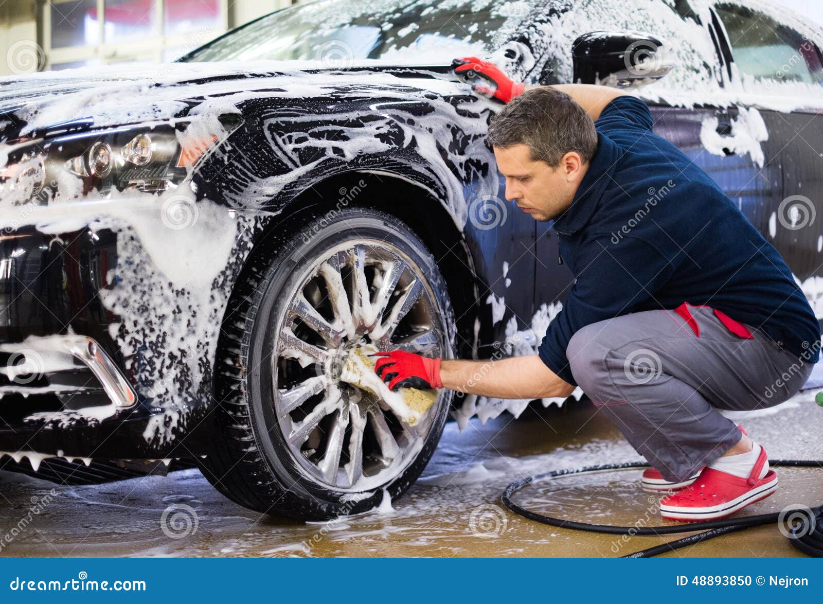 man worker on a car wash