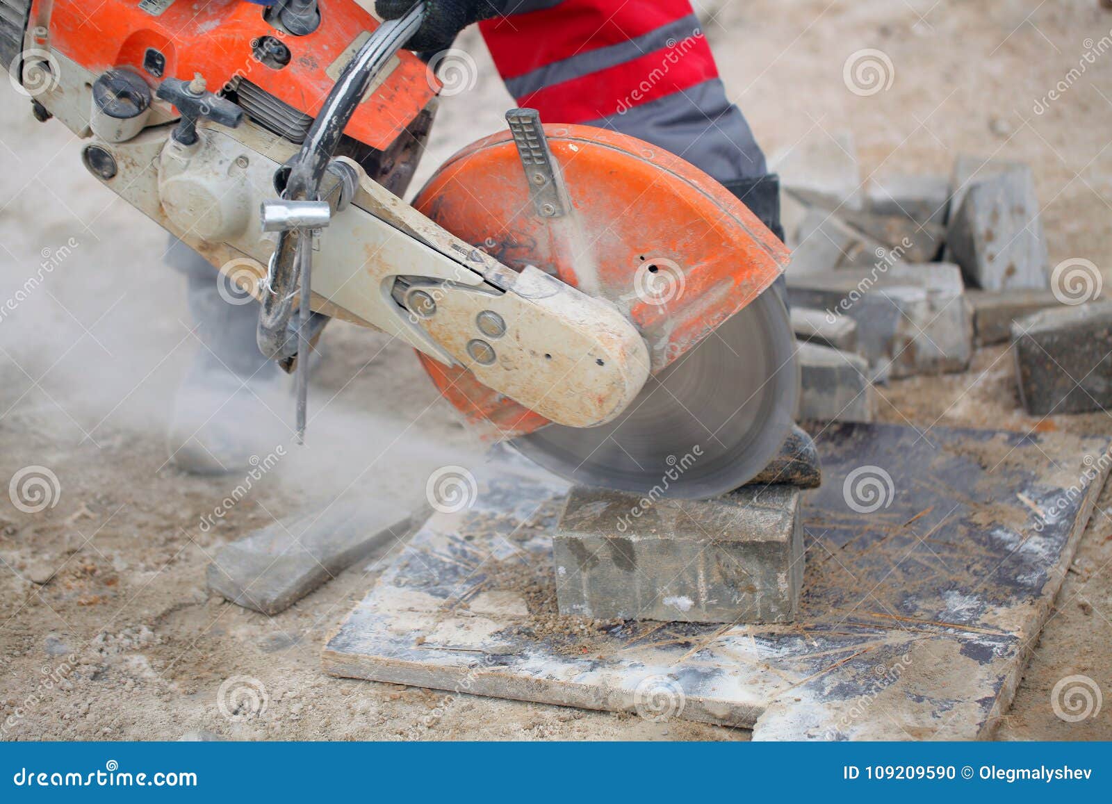 Man Cutting Concrete Pipe Stock Photography 44234168