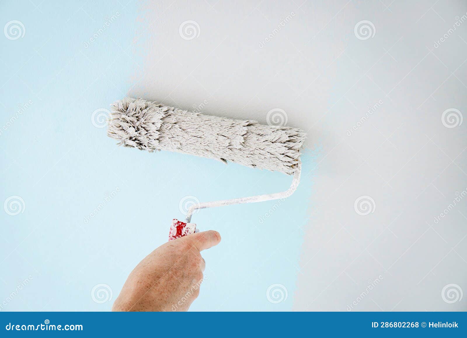 Man Worker Using Paint Roll To Repaint Old Wall Paint, Rolling Tool