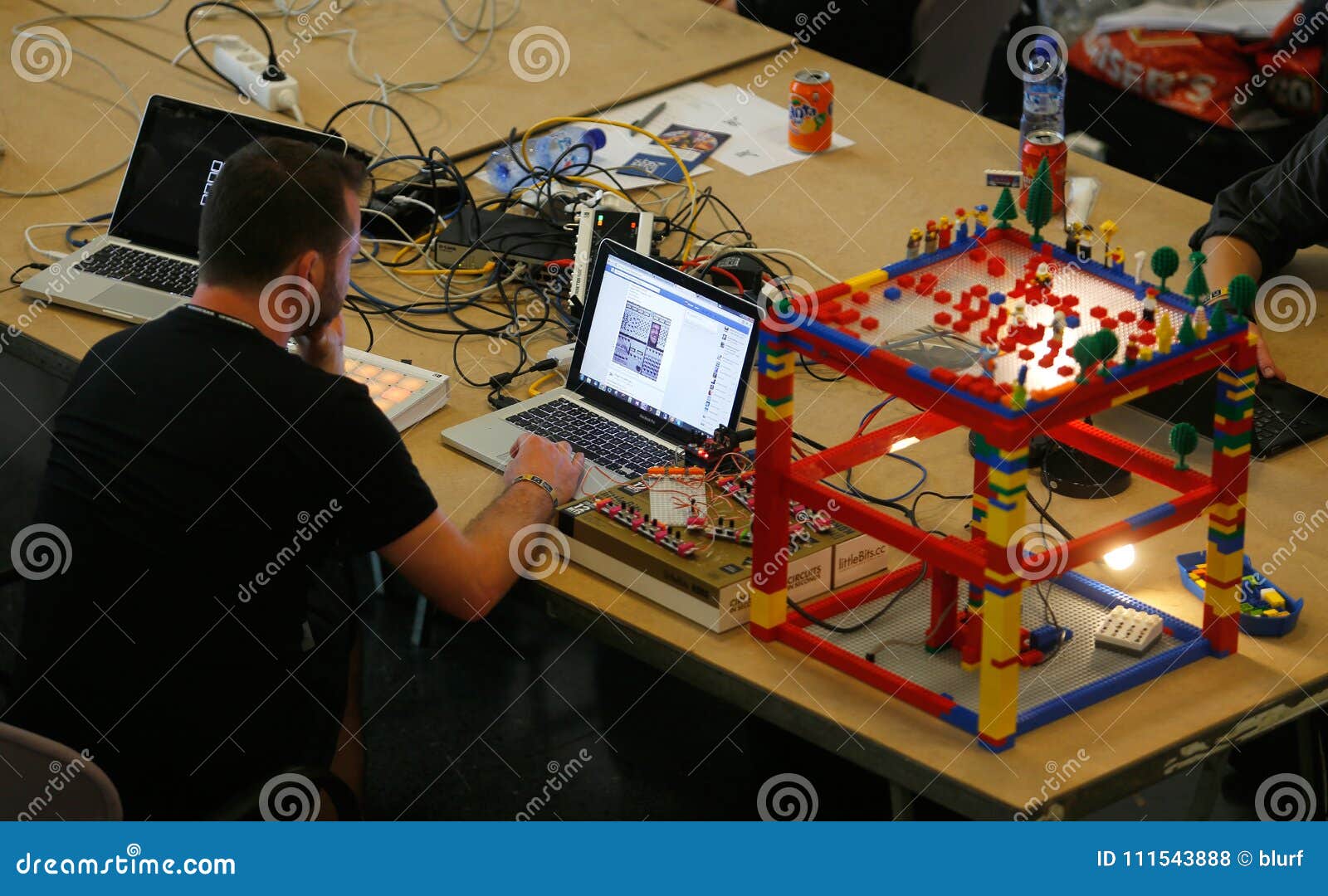 Man working on arduino components project at sonar barcelona editorial