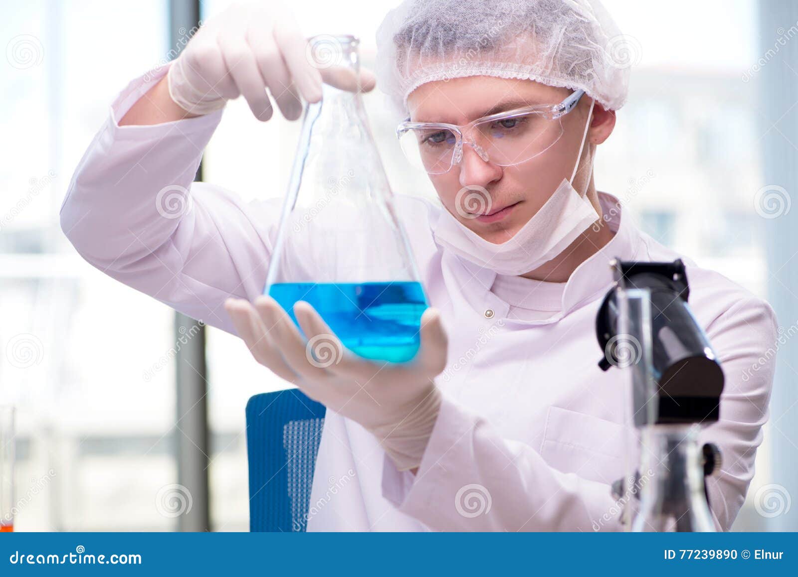 The Man Working in the Chemical Lab on Science Project Stock Photo