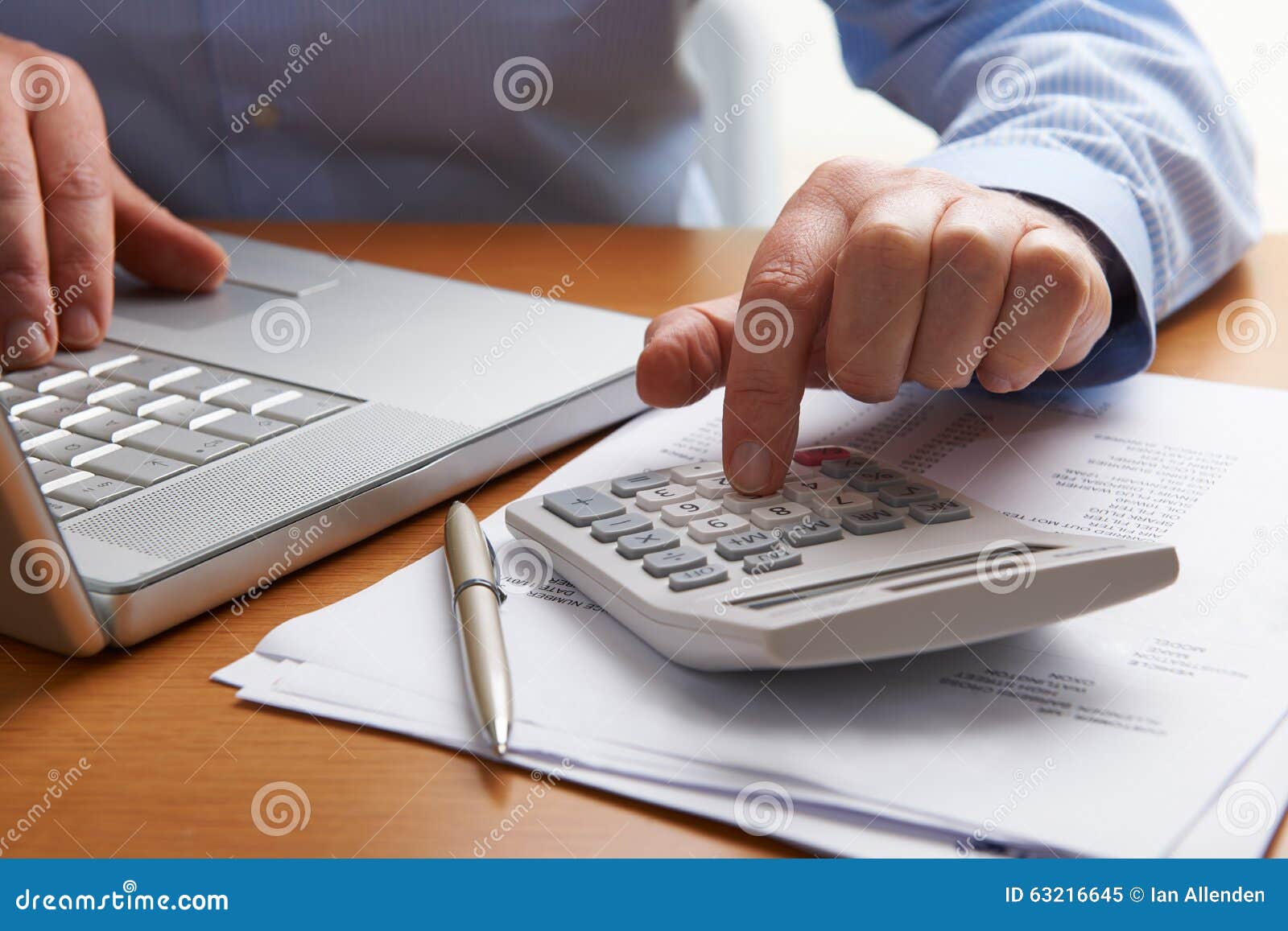 man working out household finances