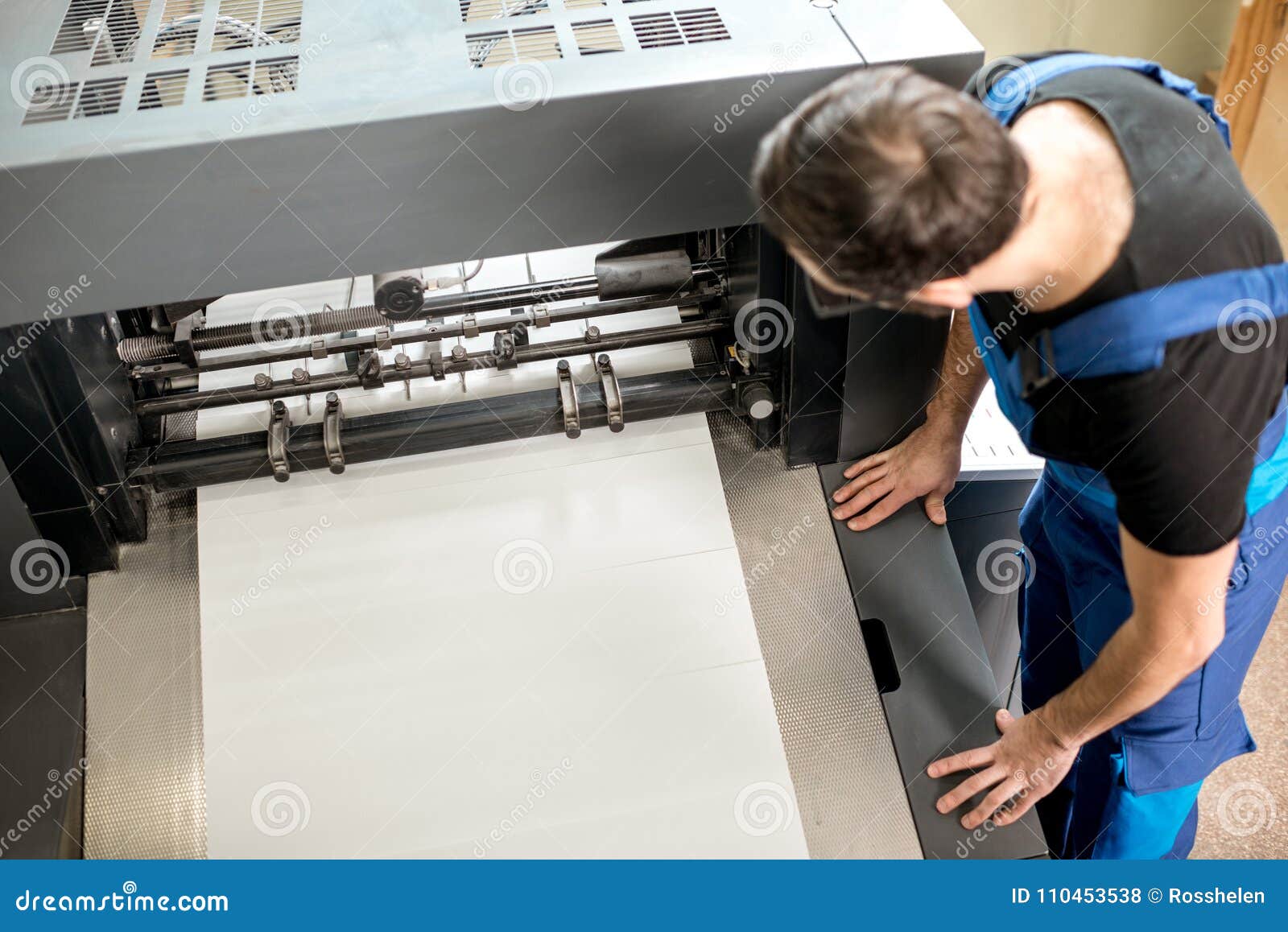 Man Working at the Printing Manufacturing Stock Photo Image of