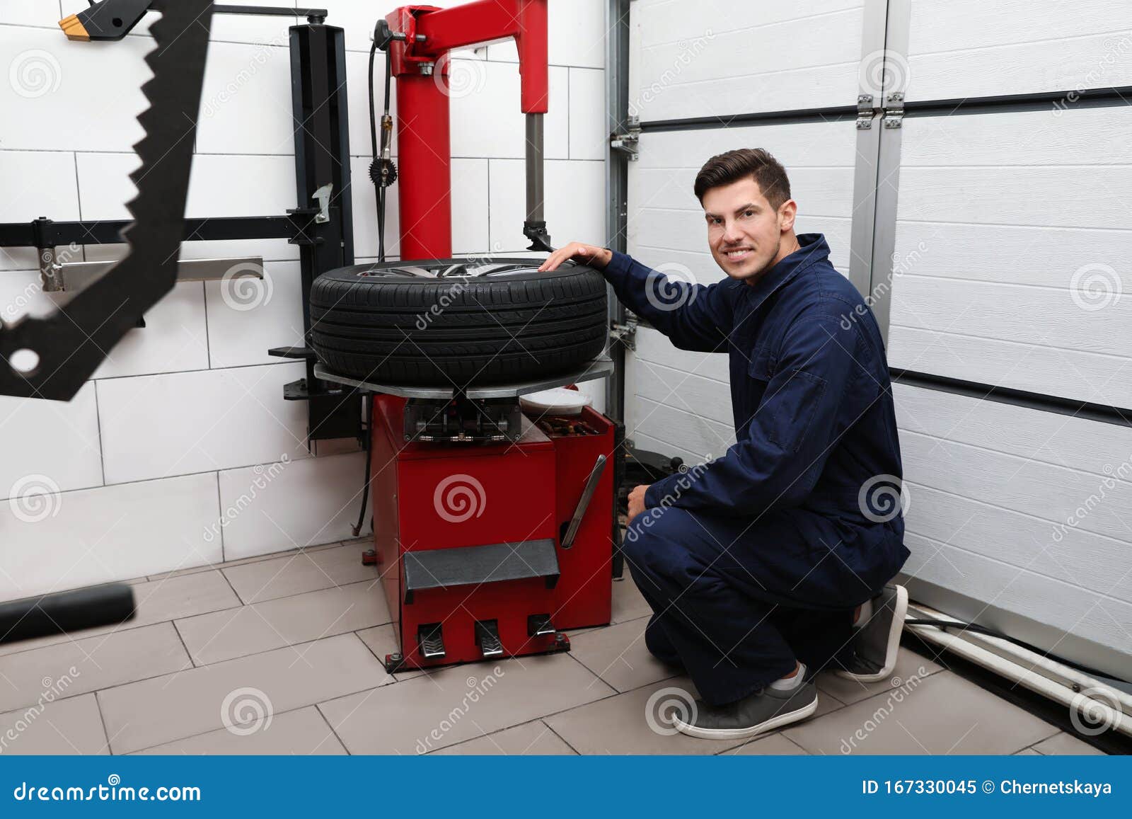 Man Working with Tire Fitting Machine at Service Stock Image Image of