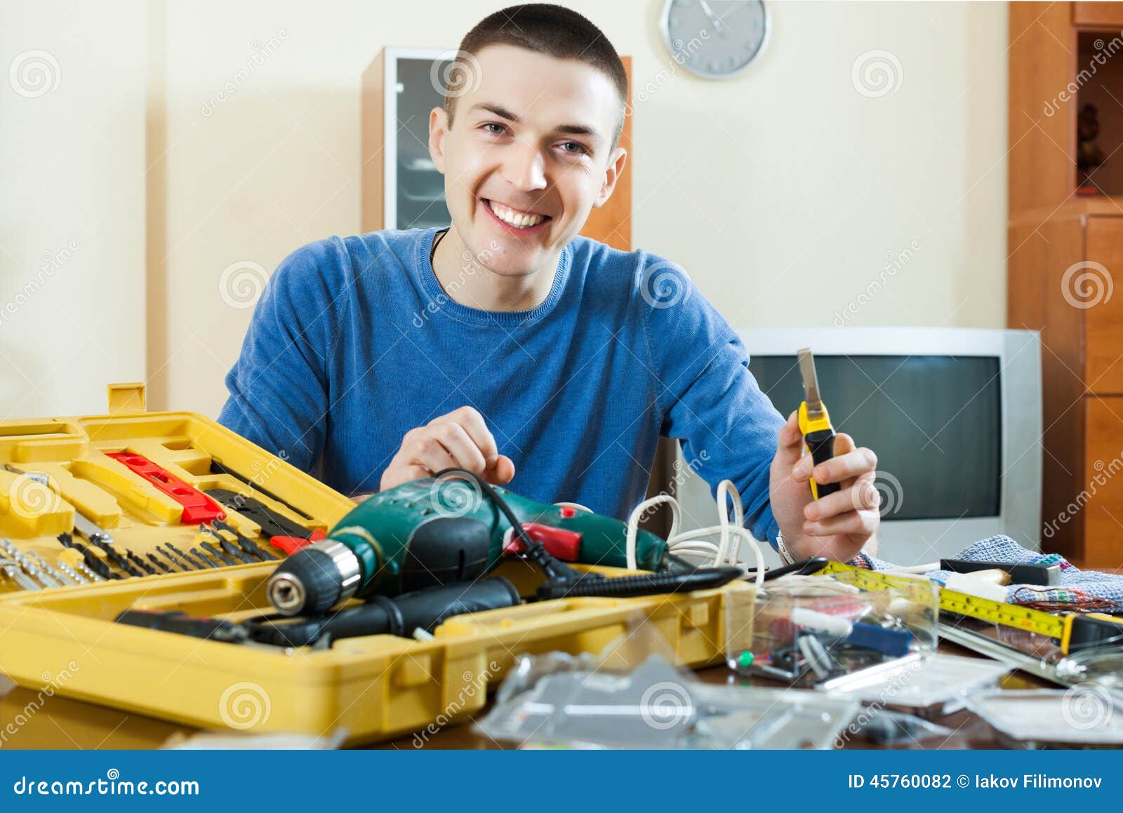 Man with working tools. Man doing something with working tools