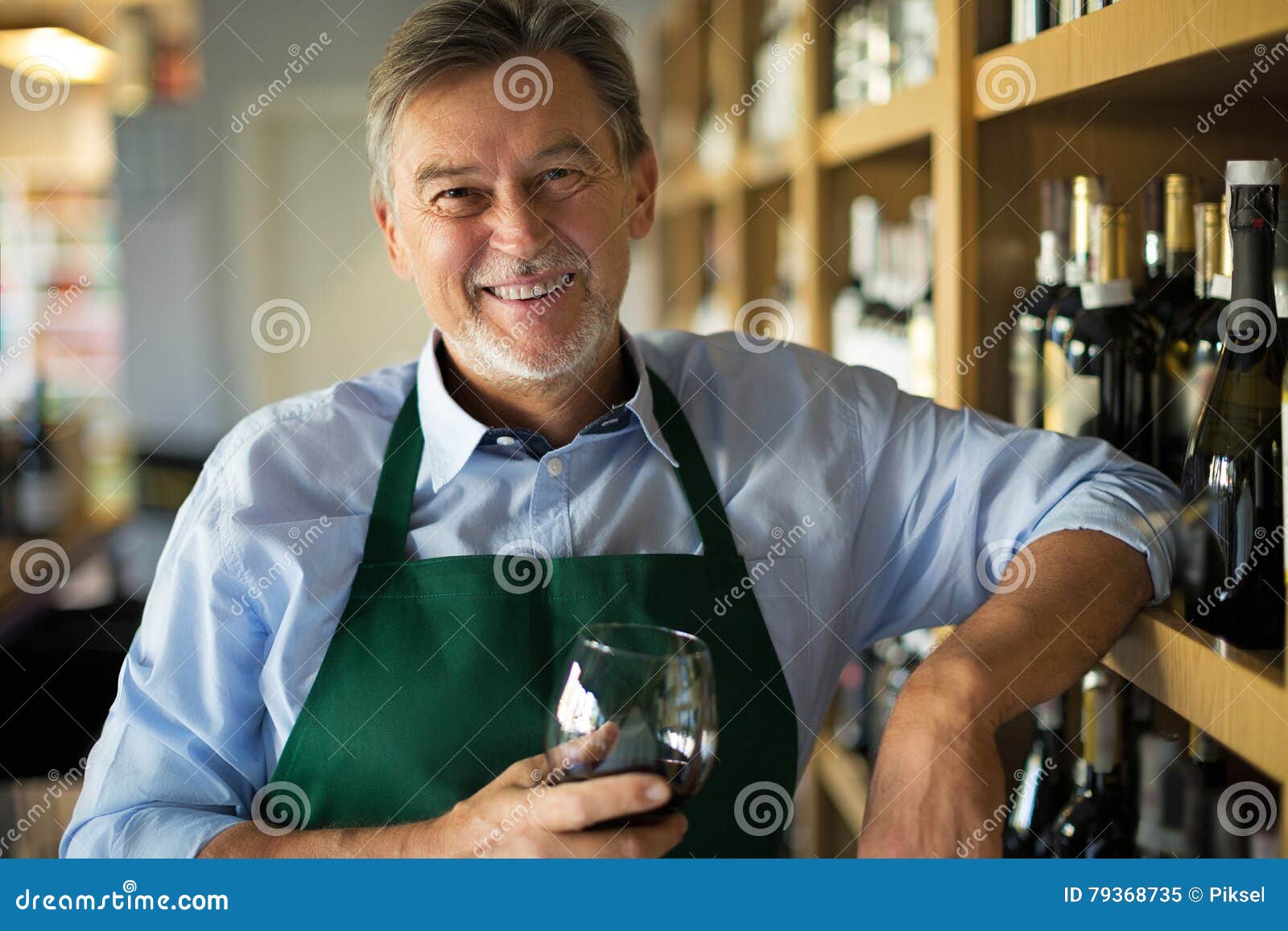 Man working in wine shop stock image. Image of selling 79368735