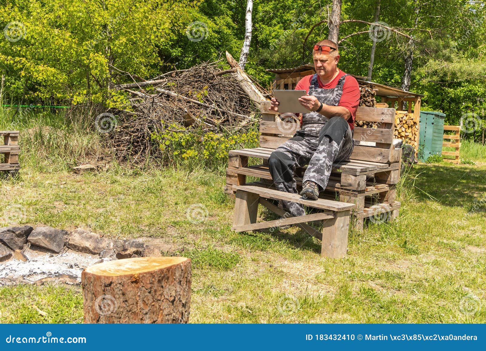 Man Working in the Woods with a Tablet. Connection at Work. the Concept of Modern