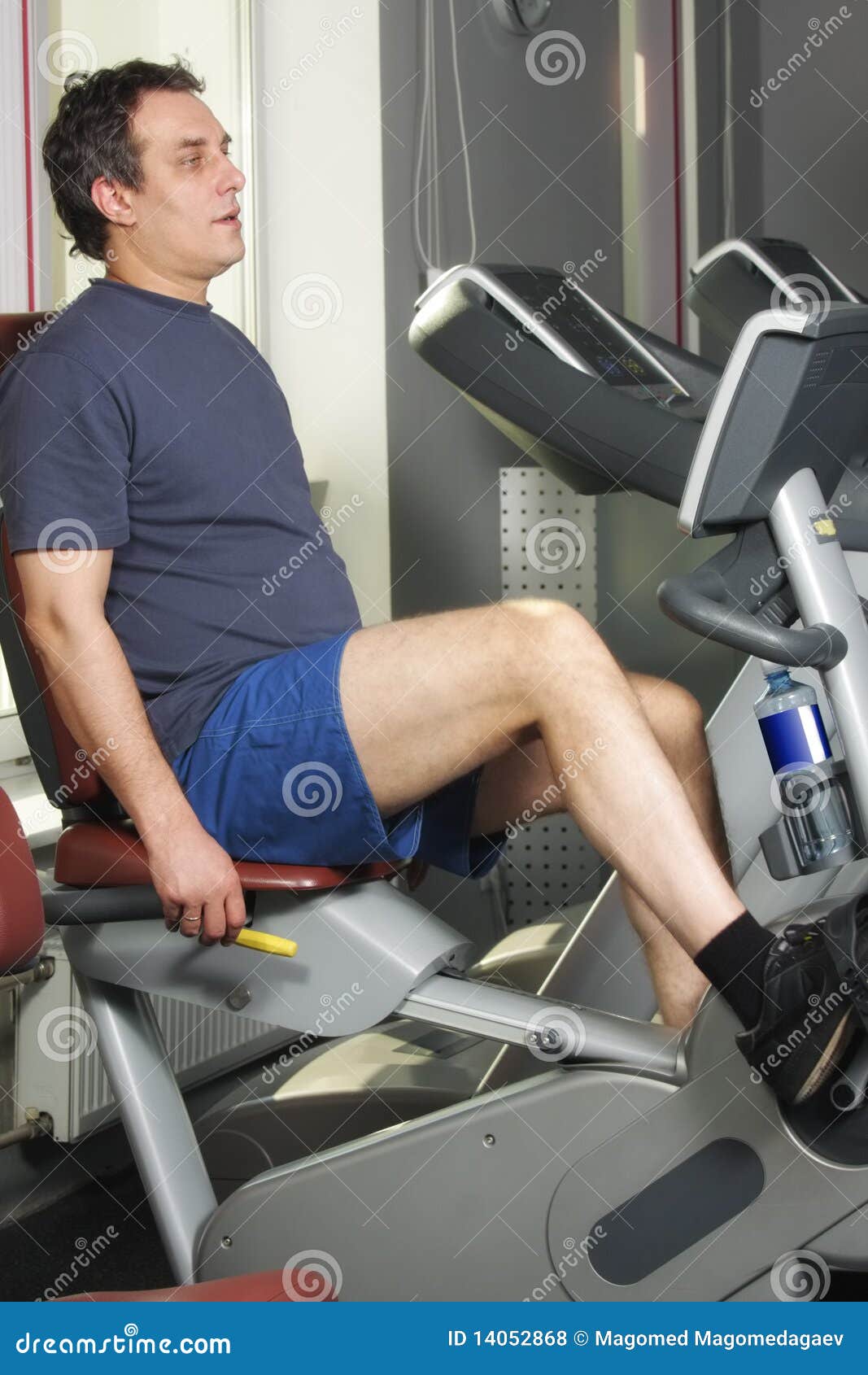 Man at Workout on Bicycle Machine Stock Photo Image of conscious, equipment 14052868