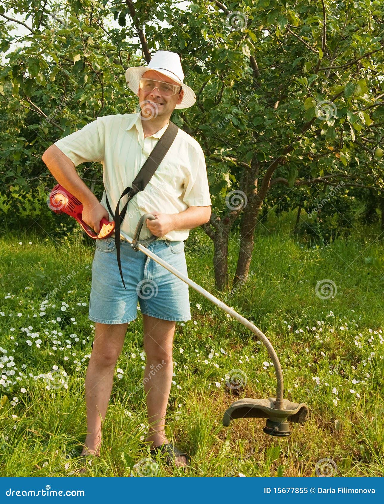 Man Works with Cordless Grass Trimmer Stock Image - Image of grass ...