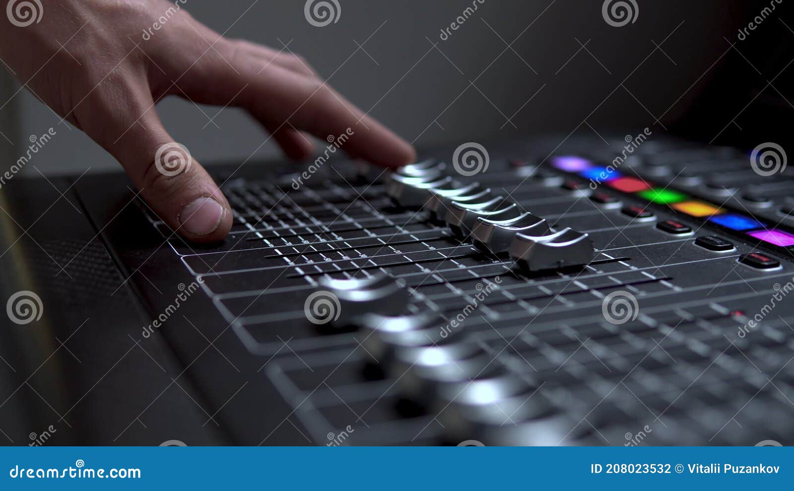 Man Works on a Professional Electronic Audio Mixer. a Control Panel for ...