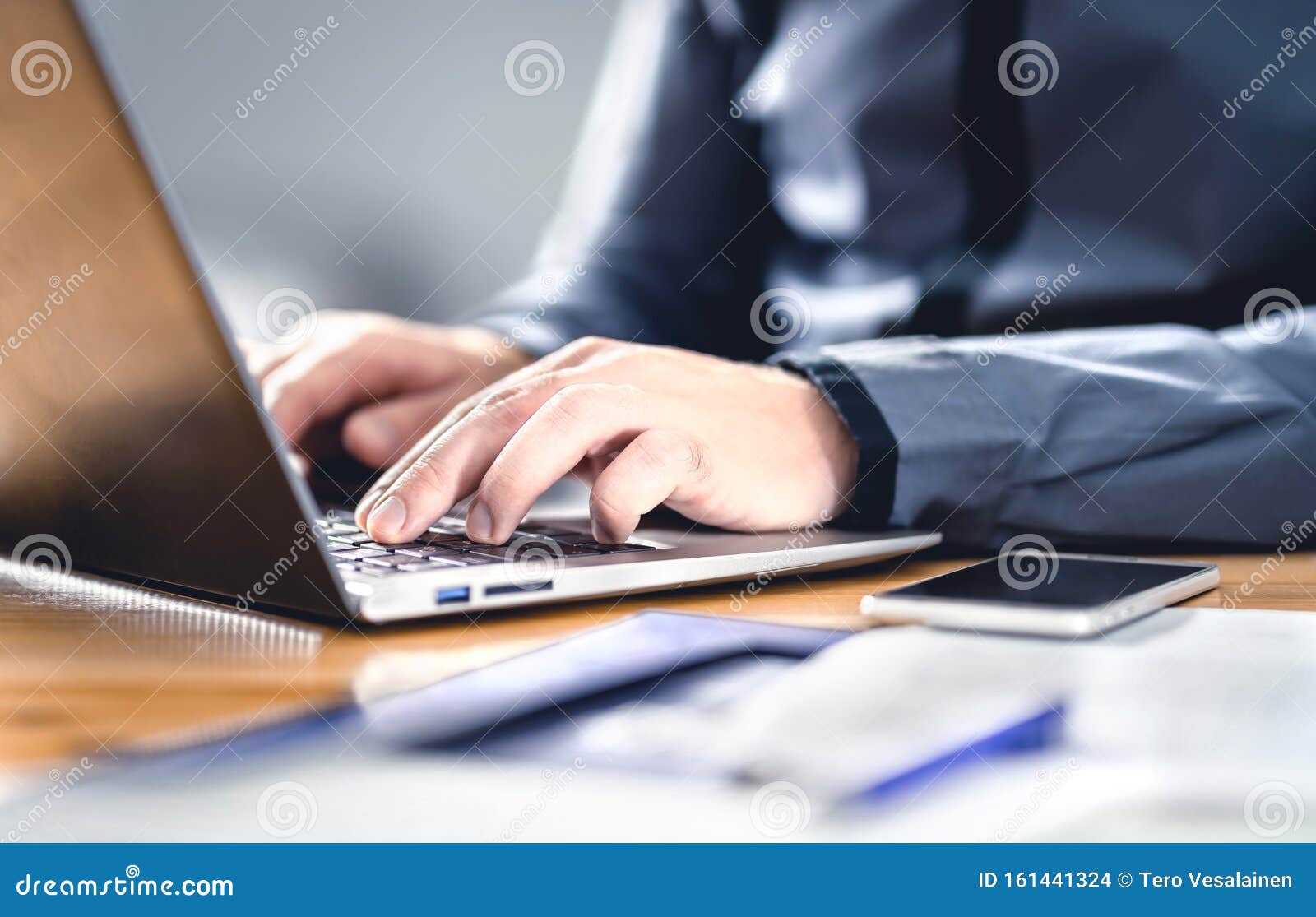 man writing with laptop. smart hipster guy with finance, market and business expertise. freelance work with digital device.
