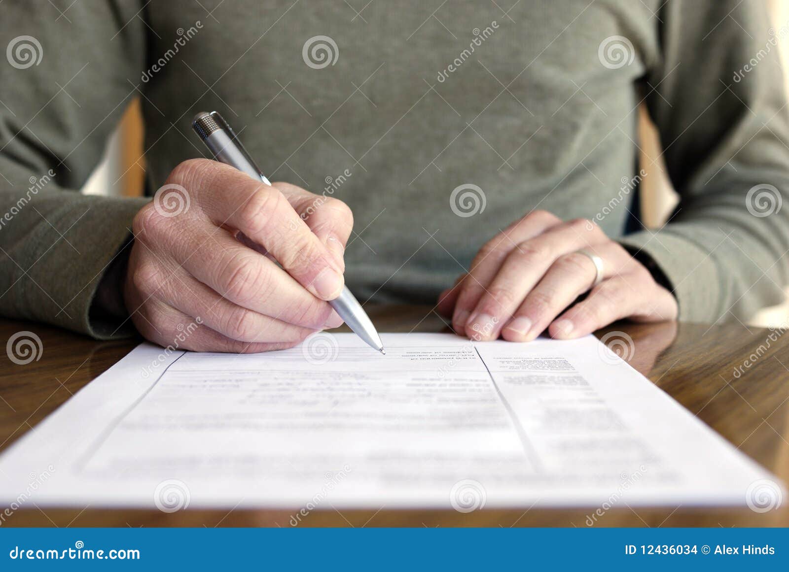 man-writing-paper-pen-table-12436034.jpg