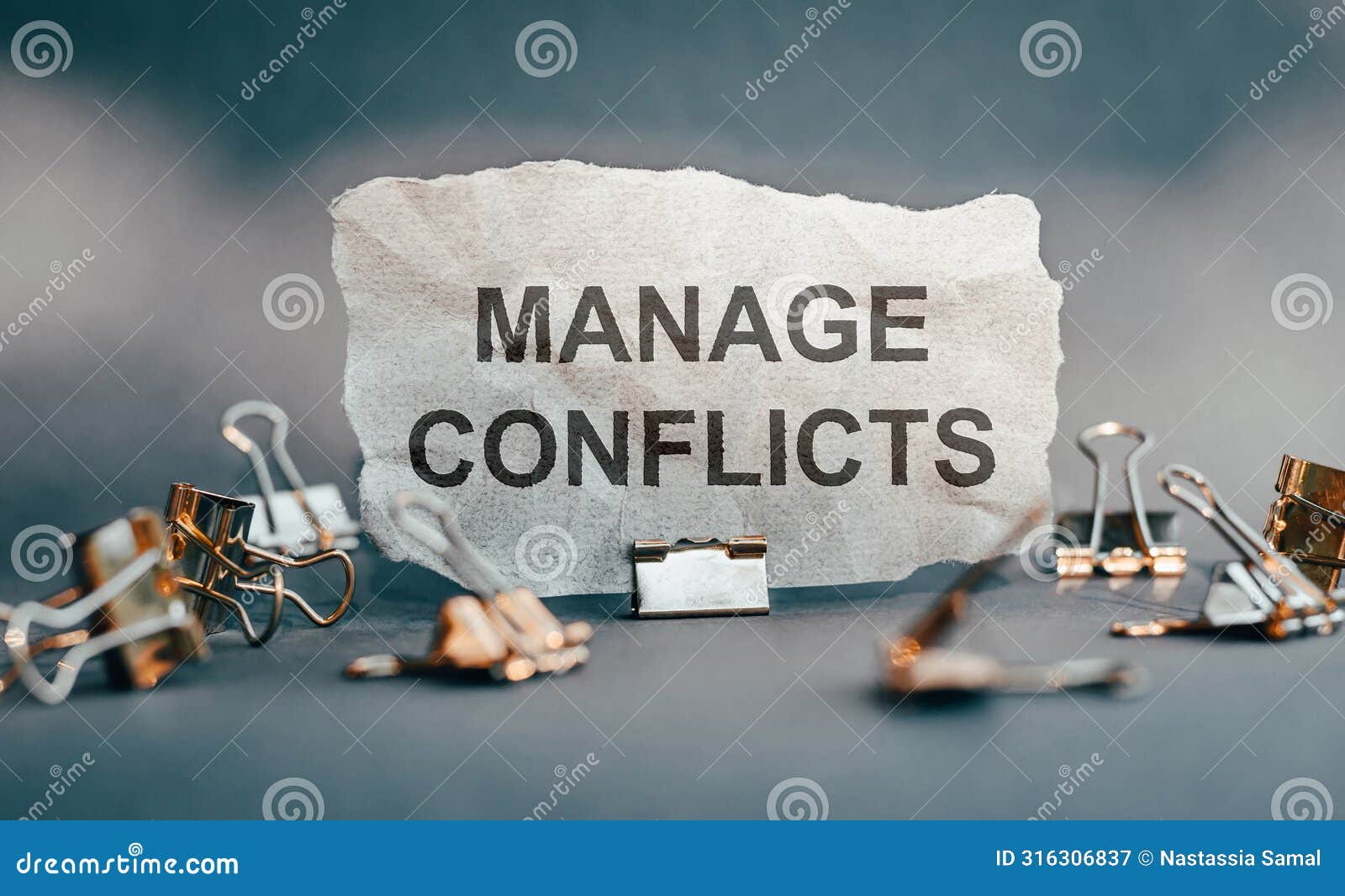 manage conflicts text on peace of paper