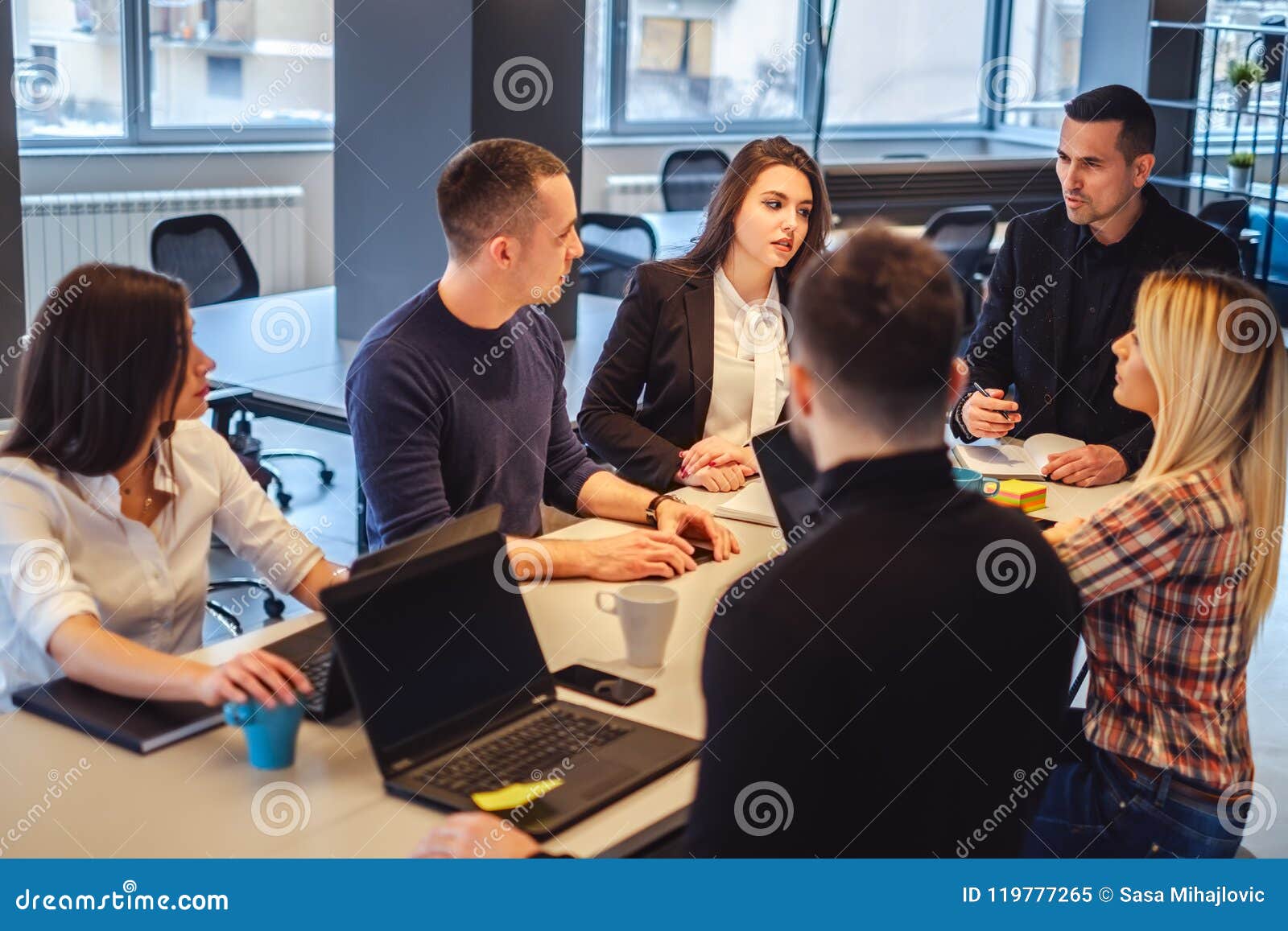 manager talking to his staff at the office meeting