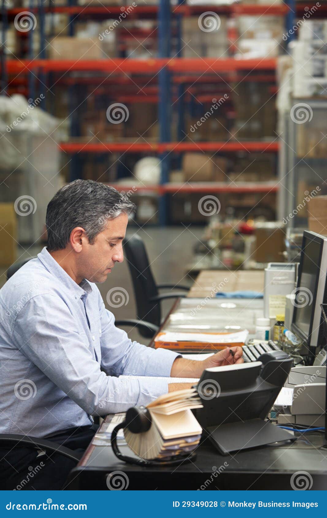 Manager Working at Desk in Warehouse Stock Photo Image of caucasian, male 29349028