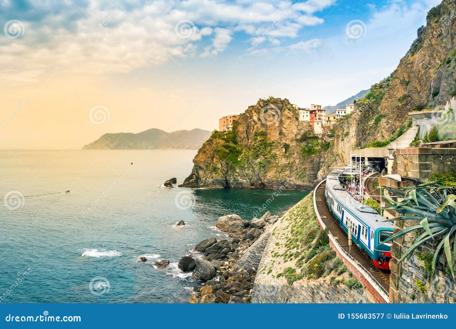 manarola, cinque terre - train station in famous village with colorful houses on cliff over sea in cinque terre