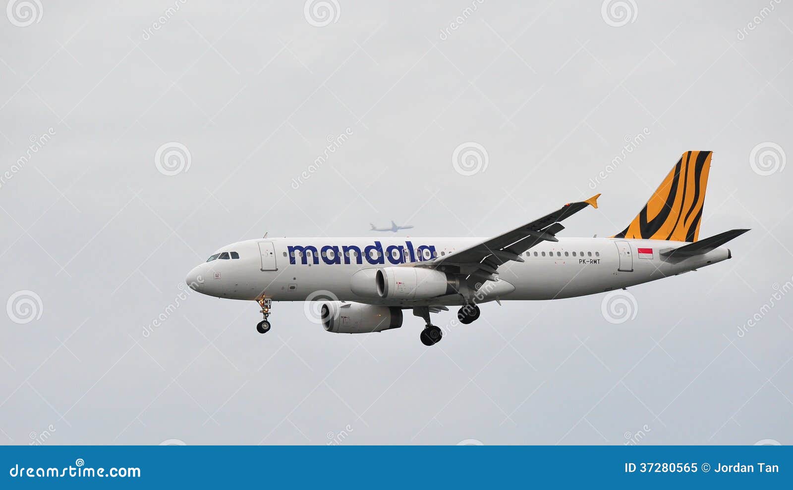 SINGAPORE - DECEMBER 25: Mandala Airbus A320 landing at Changi Airport on December 25, 2013 in Singapore