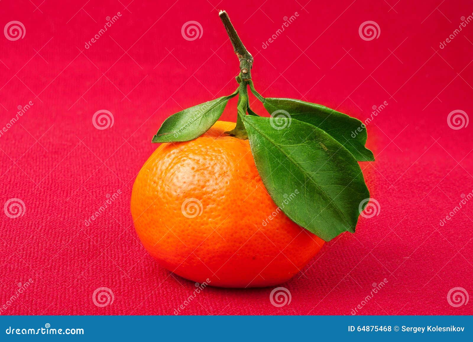 Mandarin Orange, with Green Leaf, Isolated on Red Background Stock