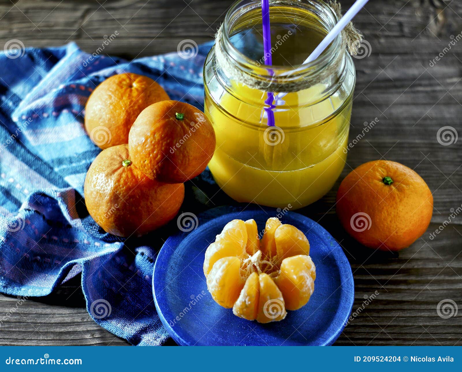 mandarins and glass jar with juice