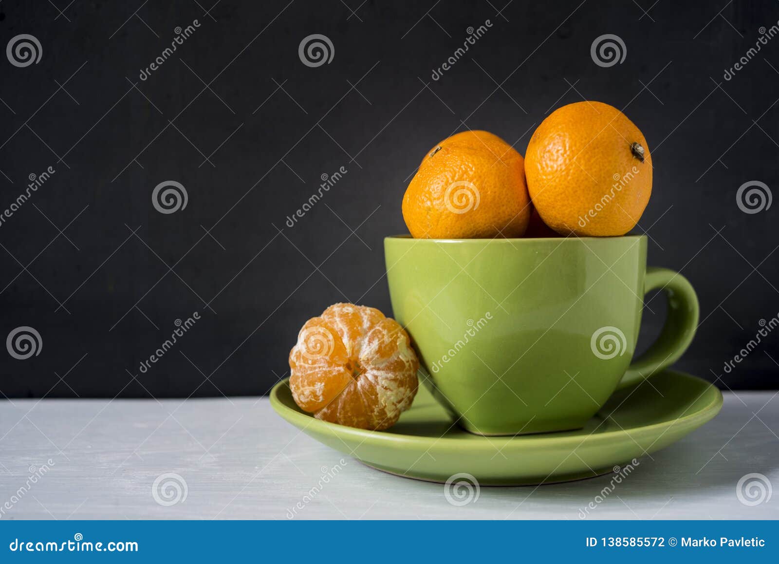 Mandarins in a green cup stock photo. Image of ingredient 138585572