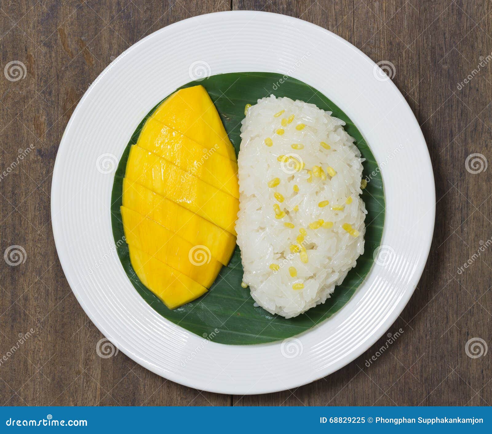 The Mango Sticky Rice with Peeled Split Mung Bean on White Plate Stock