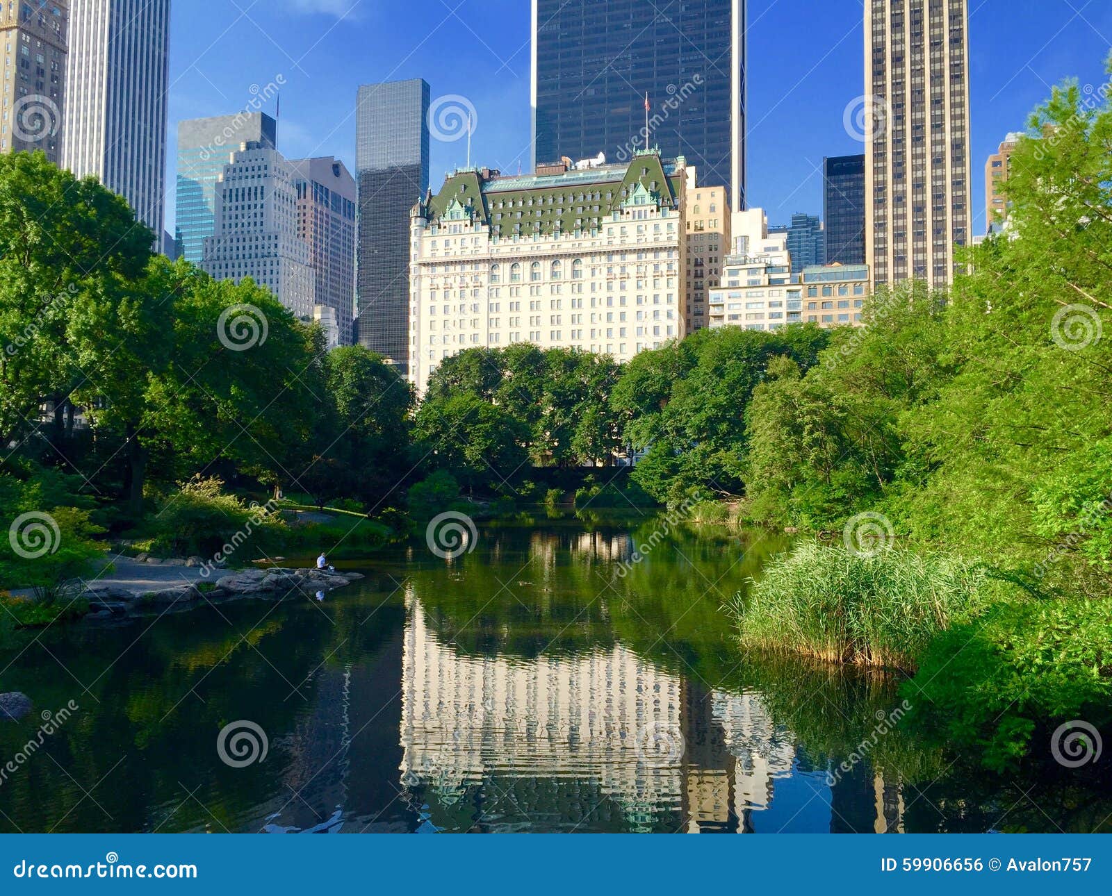 Manhattan Cityscape with Reflection in Central Park Lake Stock Photo ...