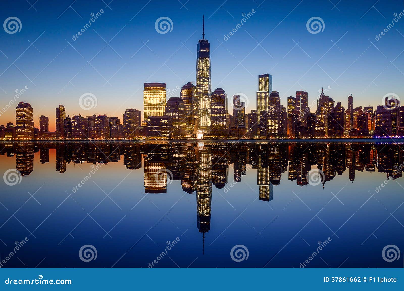 manhattan skyline with the one world trade center building at twilight