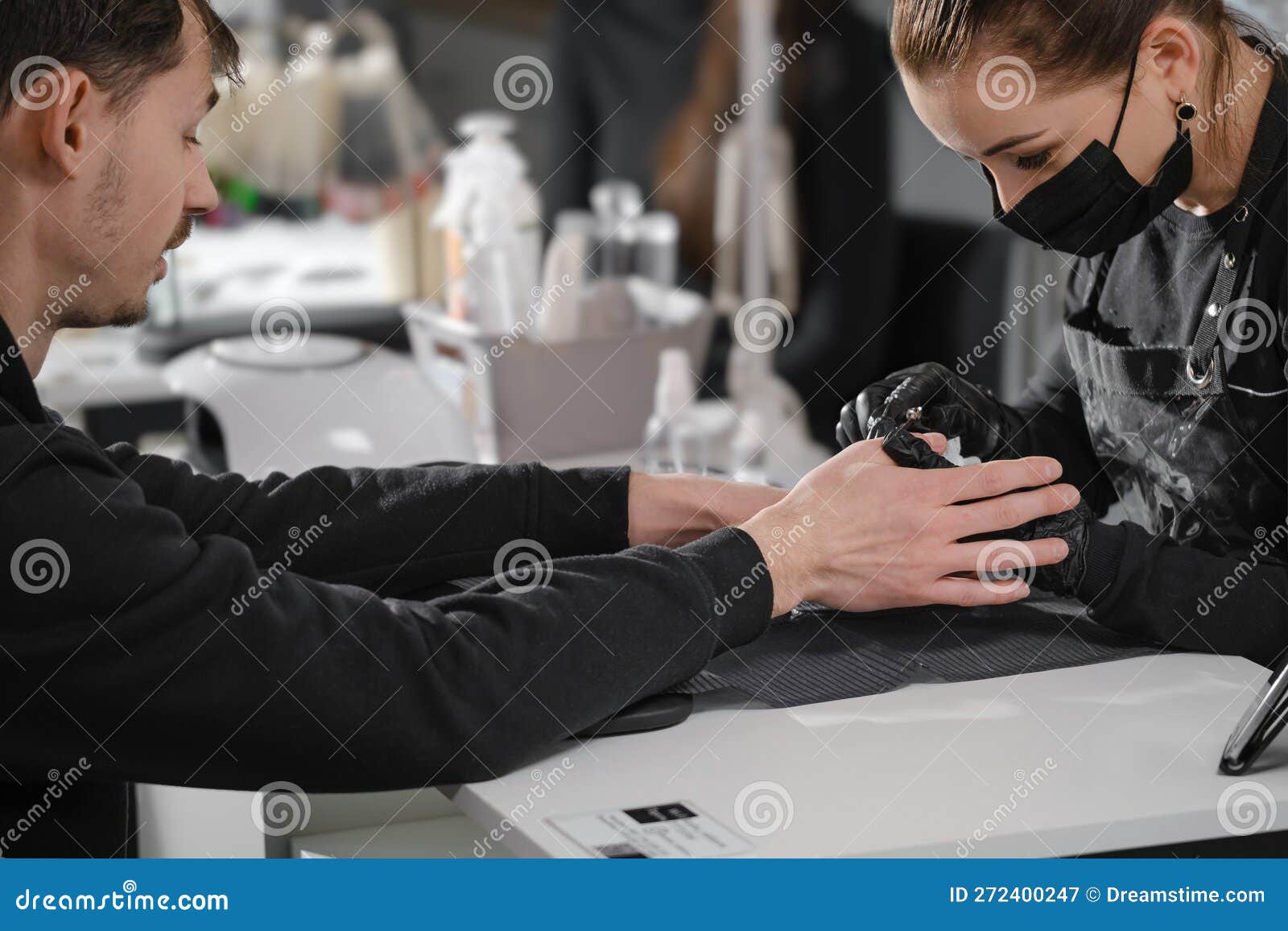 manicure for men. close up view of the nail service master doing manicure for man