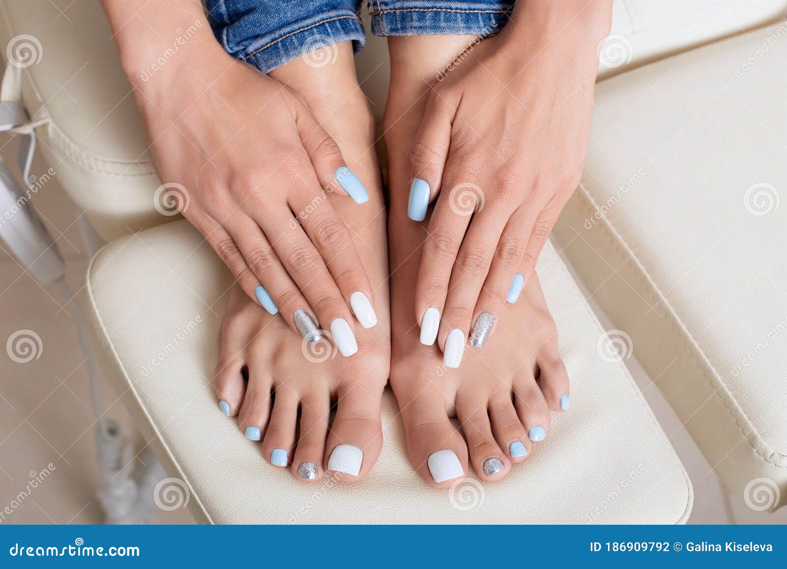 Manicure And Pedicure With White Blue And Silver Gel Polish On Nails