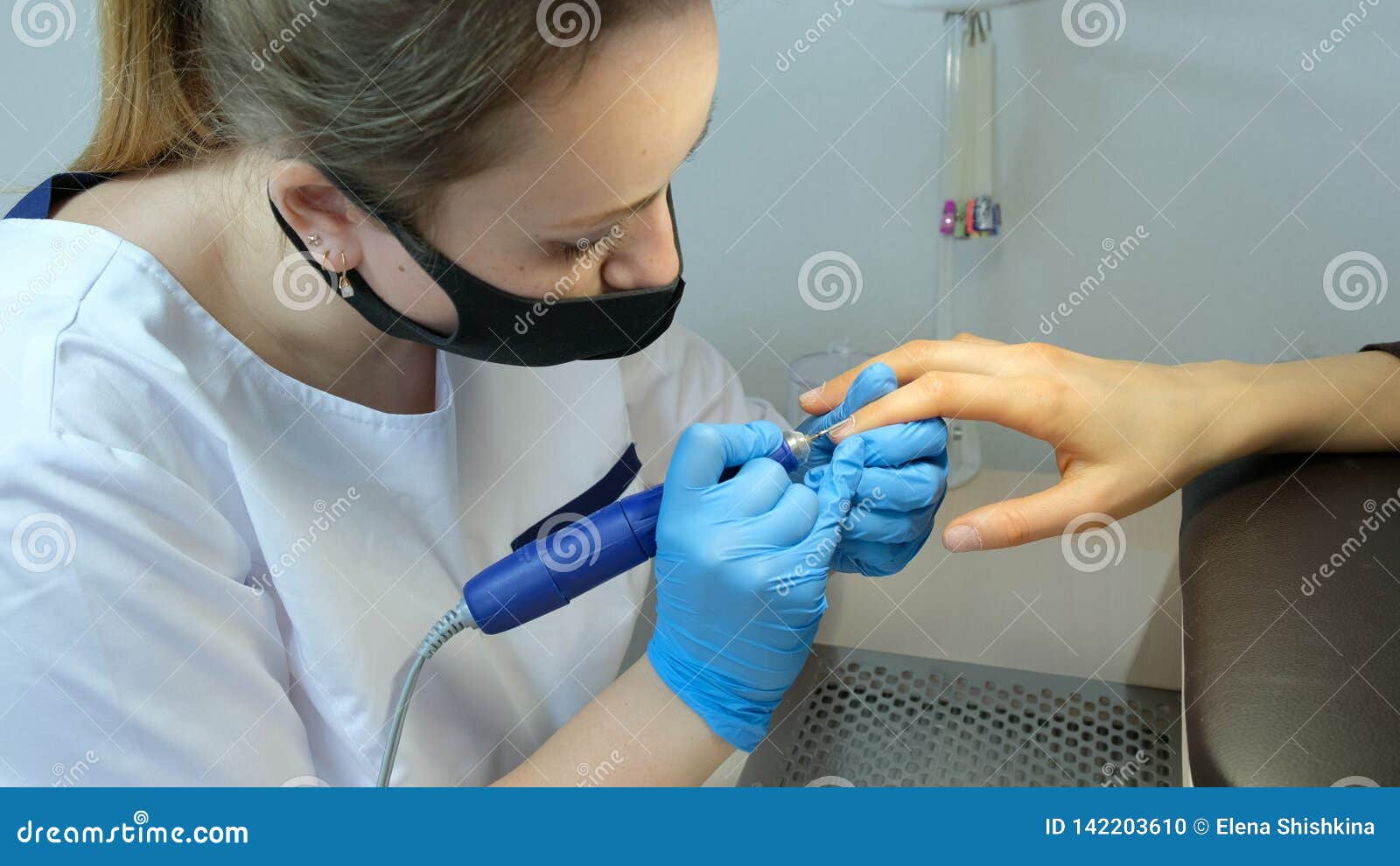 Manicure Process, Cleaning of Nails by a Milling Cutter. Stock Photo