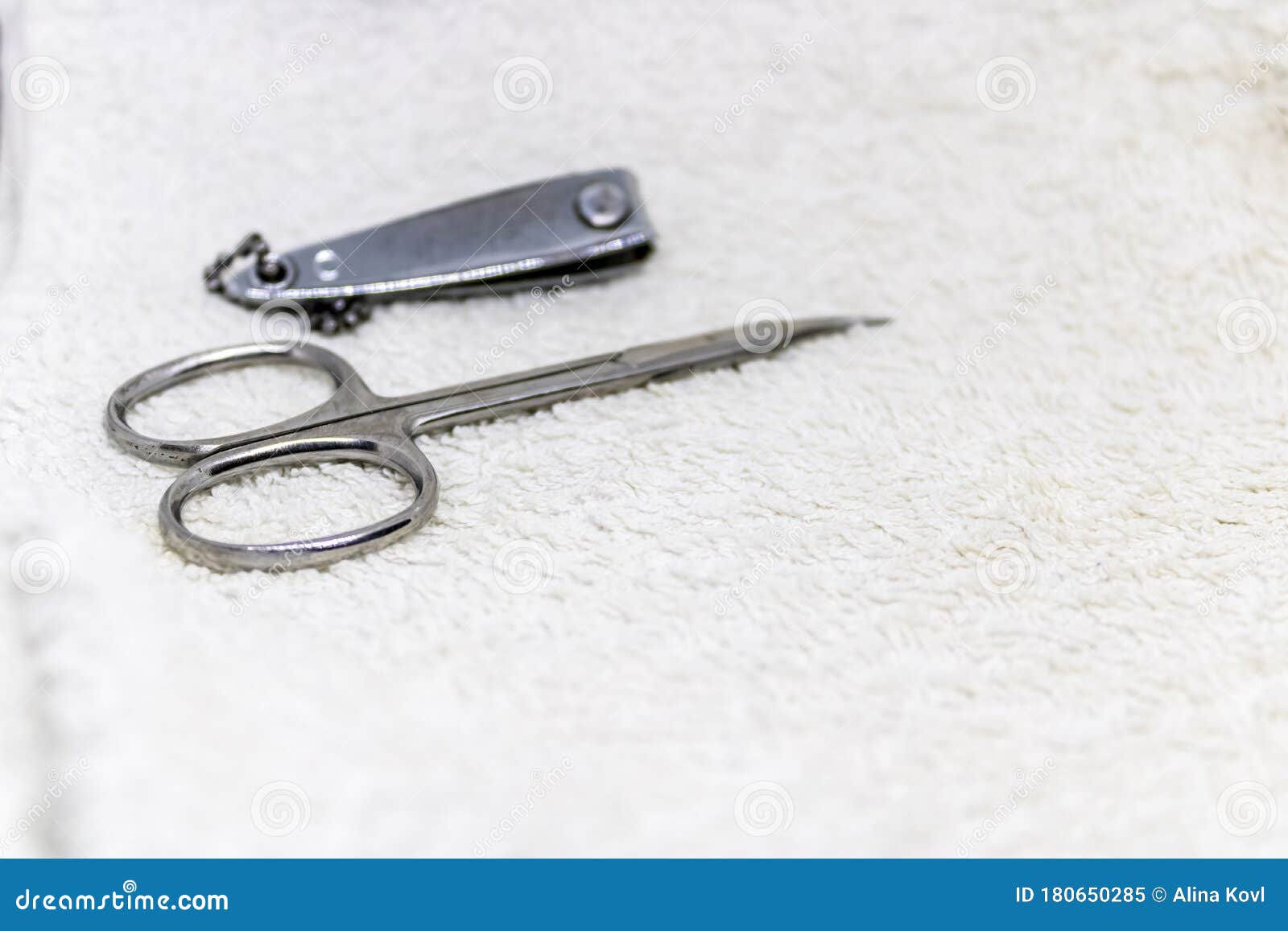 Manicure Set Closeup, Nail Scissors and Nail Clipper, Nail Cutting Tools on White Towel Ready