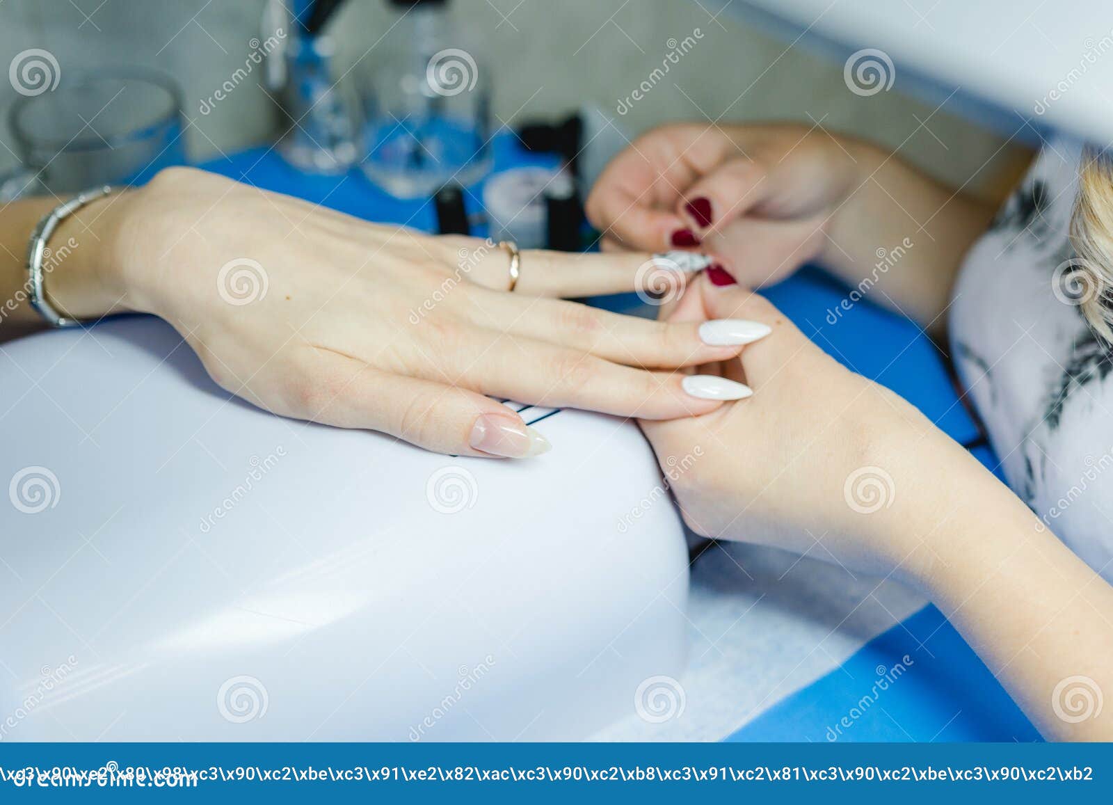 manicure. the woman cleans and paints nails. the woman processes nails on hands a varnish. shelak. gel, a varnish, placing acryle