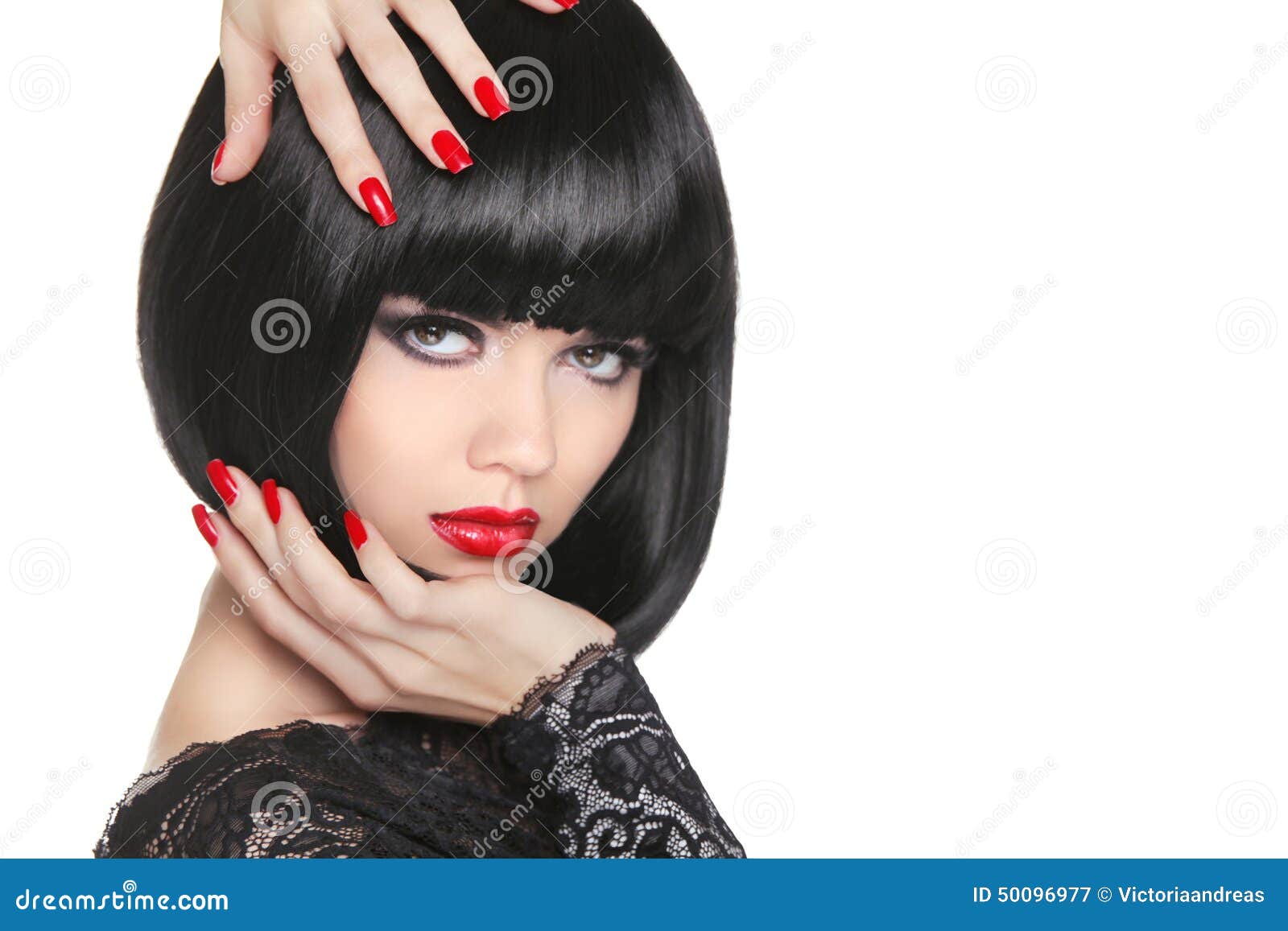 manicured nails. beauty girl portrait. red lips. back short bob