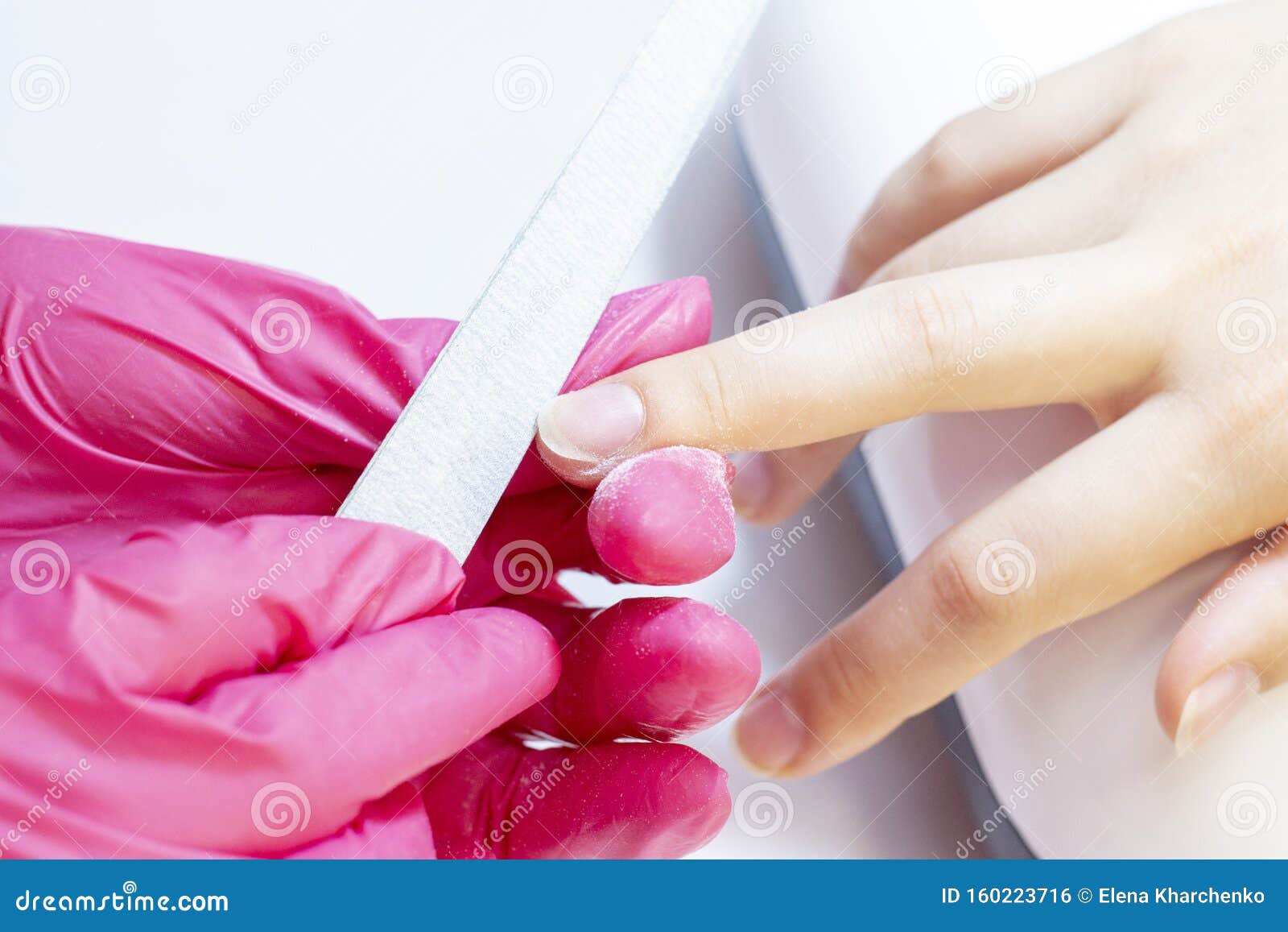 Manicurist Uses a Manicure Nail File To Process the Nail Plate and Nail