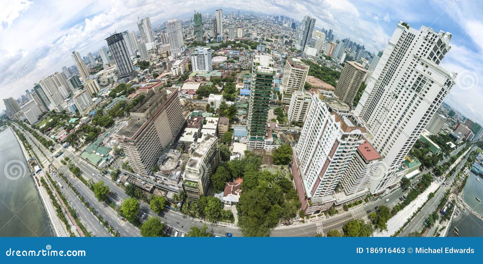 manila, philippines - fisheye panoramic aerial of roxas boulevard, manila skyline and manila bay.