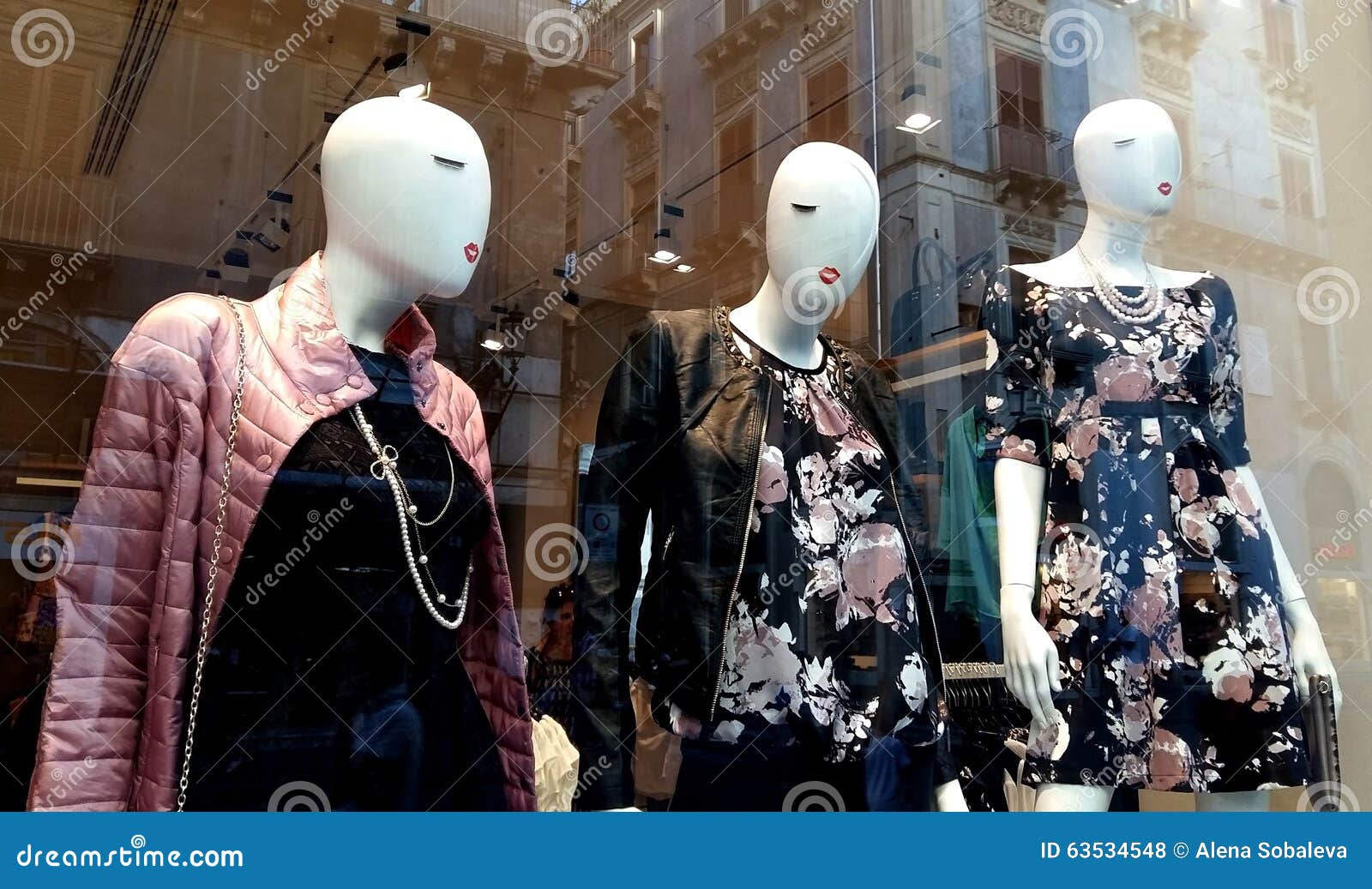 Mannequins Displaying Clothes at a Store Window Stock Photo - Image of ...